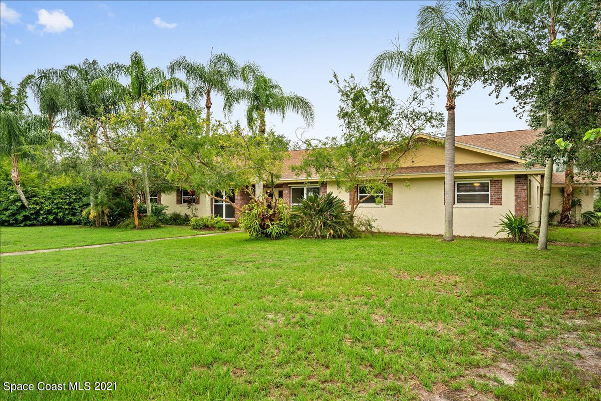 2825 Corey Road Malabar, FL 32950 - Photo 2 of 44 a view of a backyard with a garden