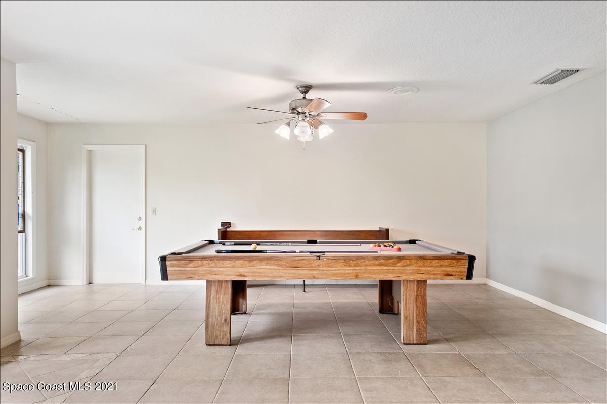 2825 Corey Road Malabar, FL 32950 - Photo 17 of 44 a room with table table and appliances