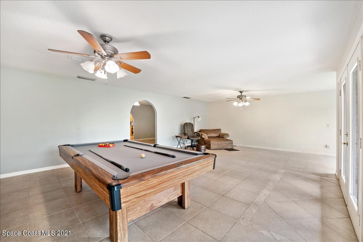 2825 Corey Road Malabar, FL 32950 - Photo 18 of 44 a room with pool table and wooden floor