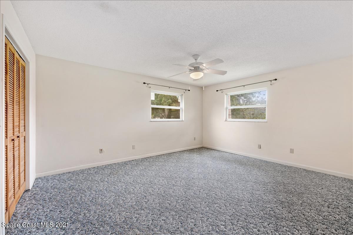 2825 Corey Road Malabar, FL 32950 - Photo 22 of 44 an empty room with windows