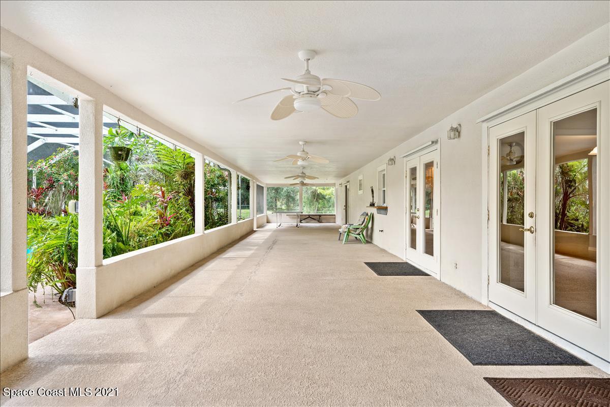 2825 Corey Road Malabar, FL 32950 - Photo 29 of 44 a view of a porch with wooden floor and outdoor space