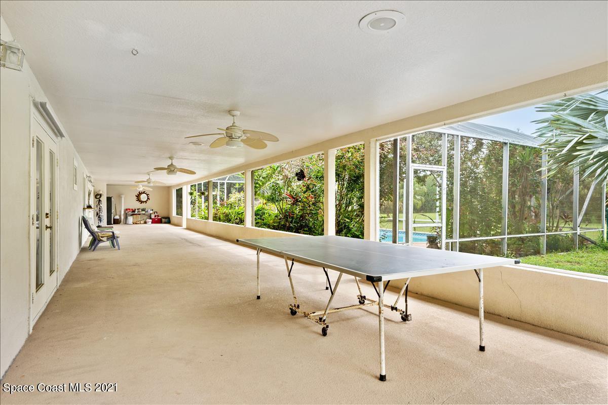 2825 Corey Road Malabar, FL 32950 - Photo 31 of 44 a living room with furniture and a large window