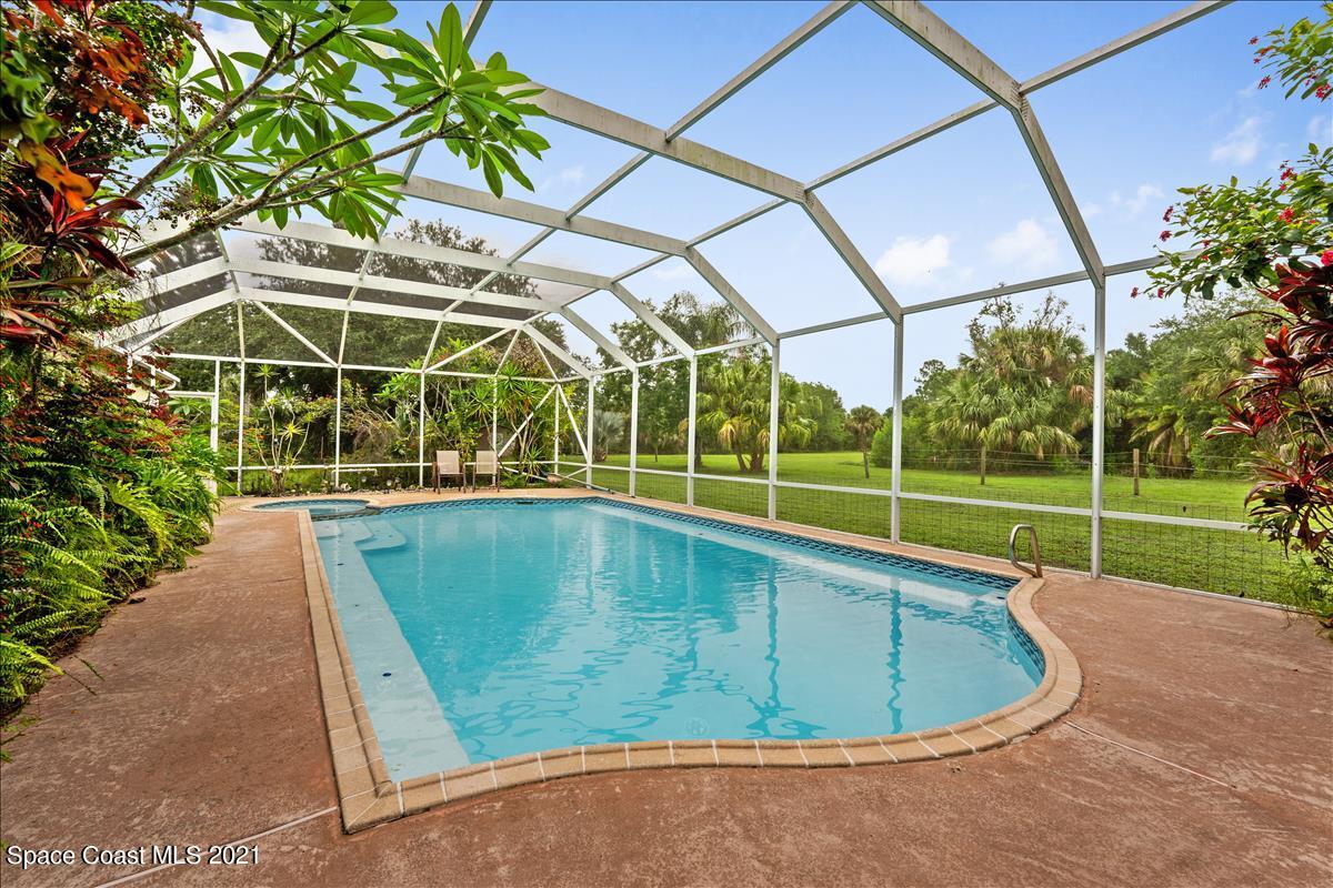 2825 Corey Road Malabar, FL 32950 - Photo 32 of 44 a view of a swimming pools under an umbrella