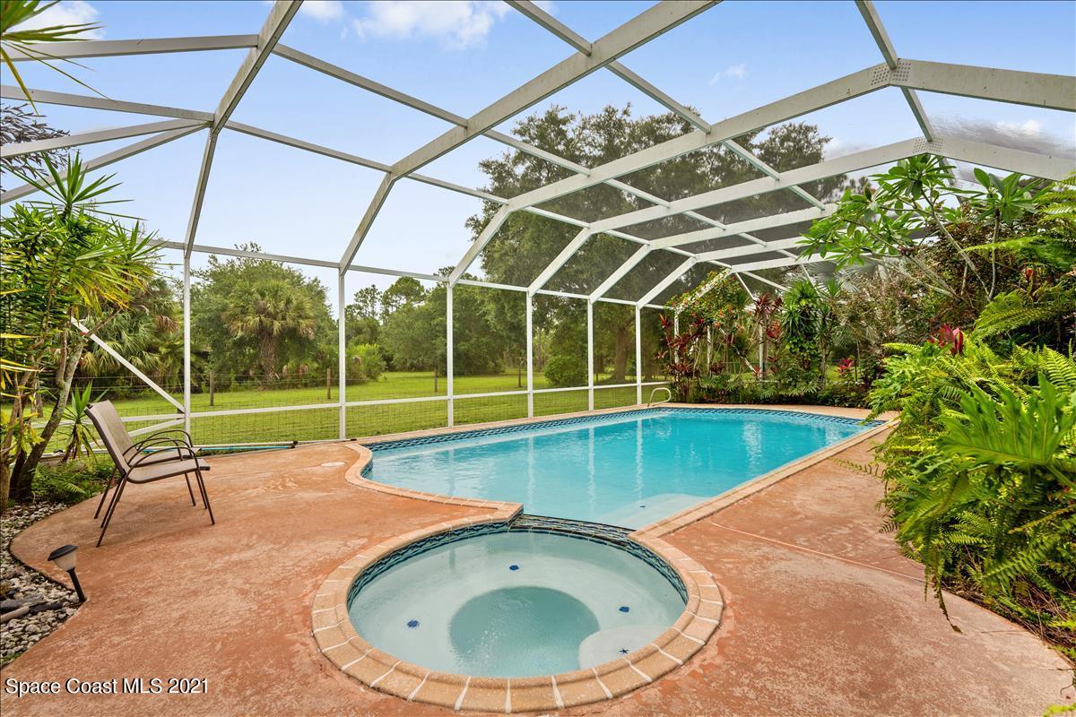 2825 Corey Road Malabar, FL 32950 - Photo 34 of 44 a view of a backyard with a swimming pool