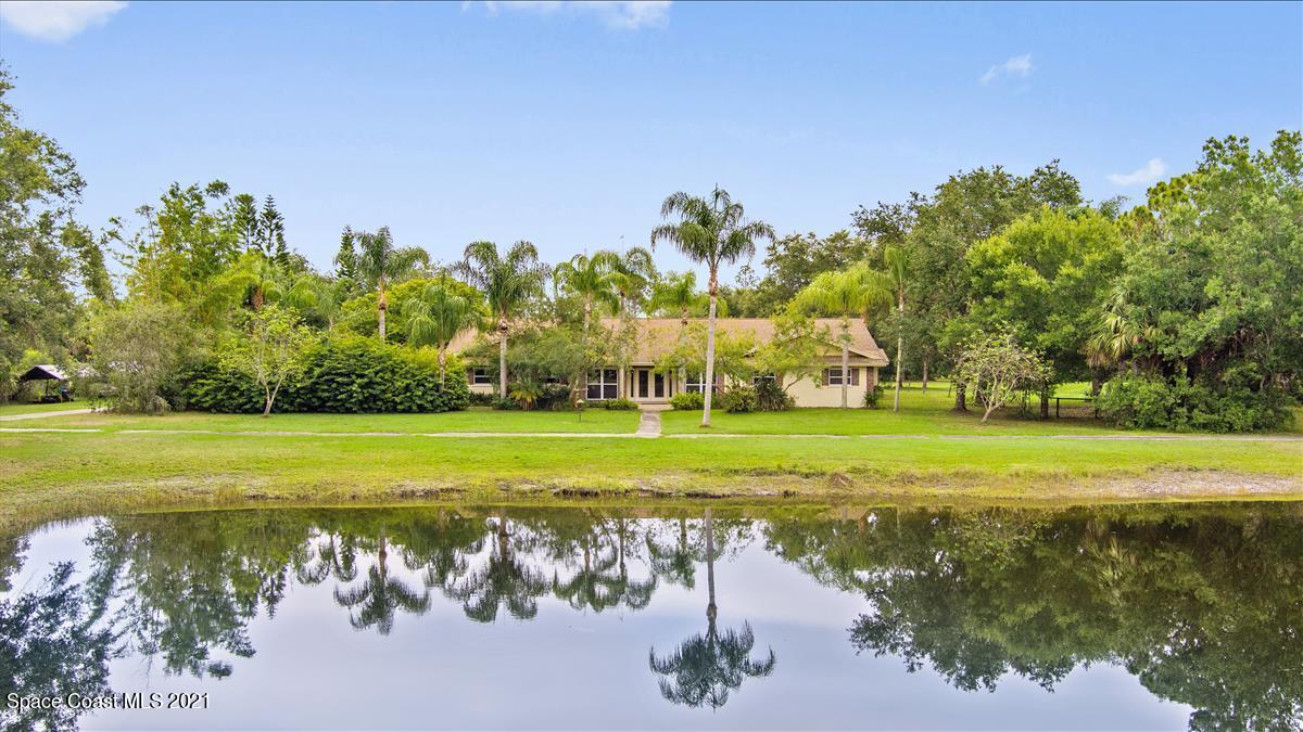 2825 Corey Road Malabar, FL 32950 - Photo 35 of 44 a view of a golf course with a lake view