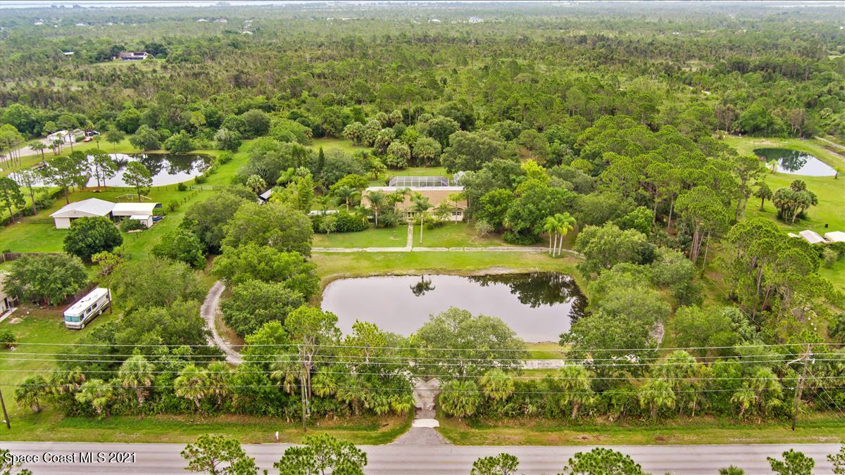 2825 Corey Road Malabar, FL 32950 - Photo 37 of 44 an aerial view of residential houses with outdoor space and trees