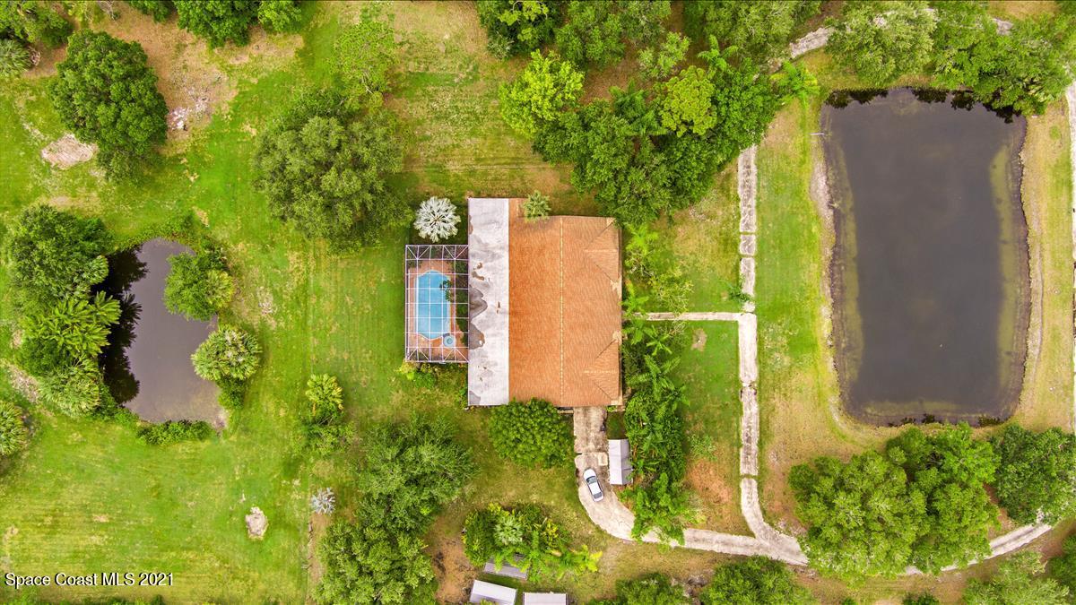 2825 Corey Road Malabar, FL 32950 - Photo 43 of 44 an aerial view of a residential houses with yard