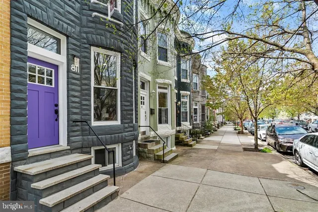 a view of a brick building with many windows