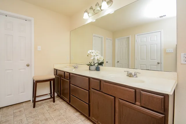 a bed room with a bed and a dresser