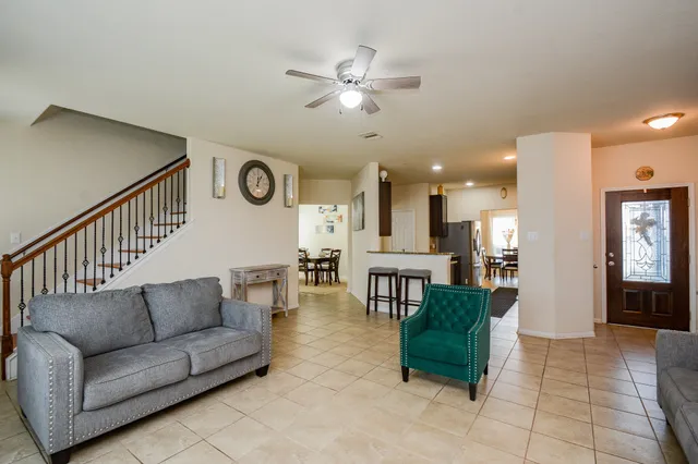 a living room with furniture and a window