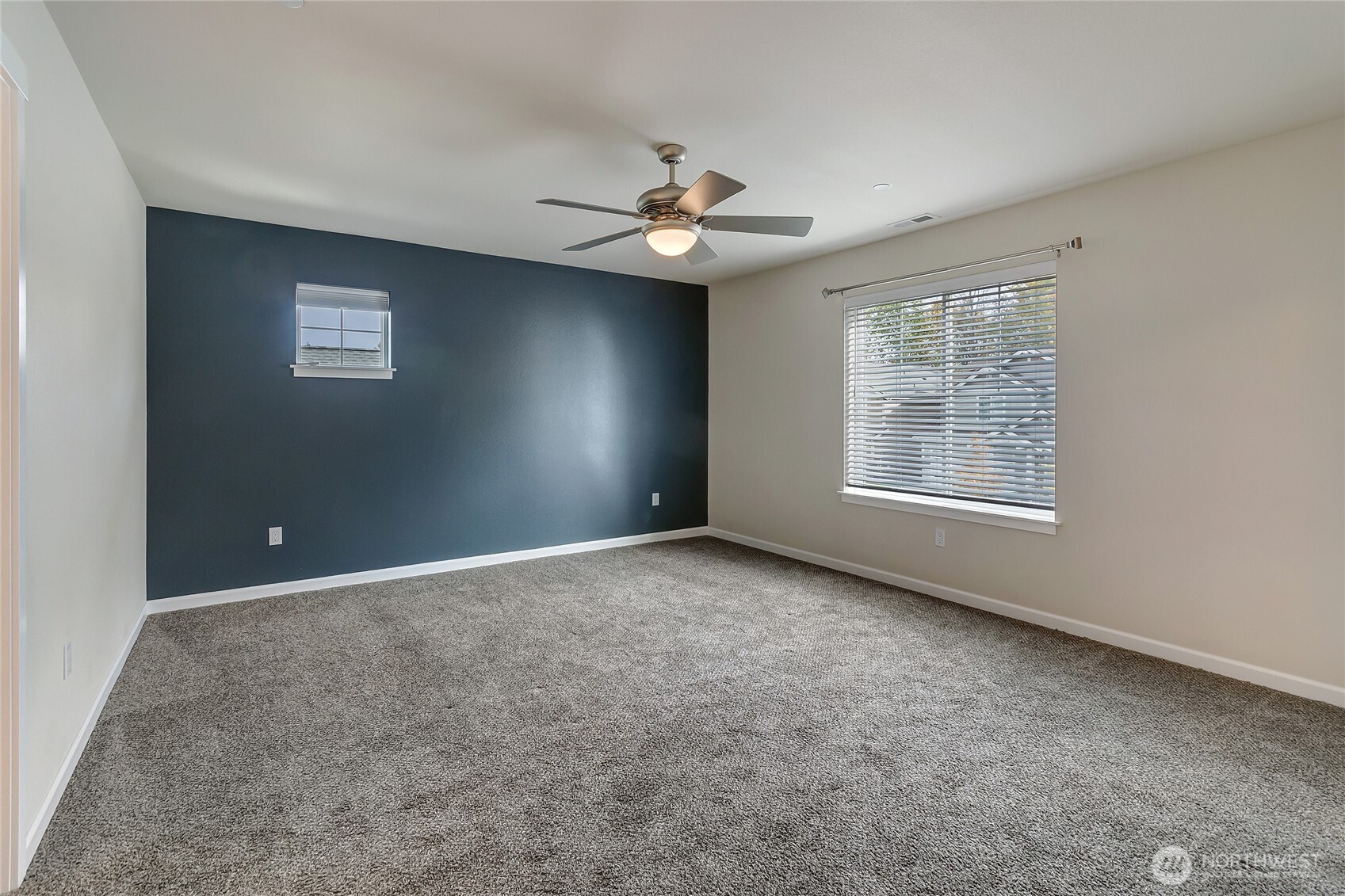 2213 Trail View Street Northeast Olympia, WA 98506 - Photo 28 of 40 an empty room with a window and ceiling fan