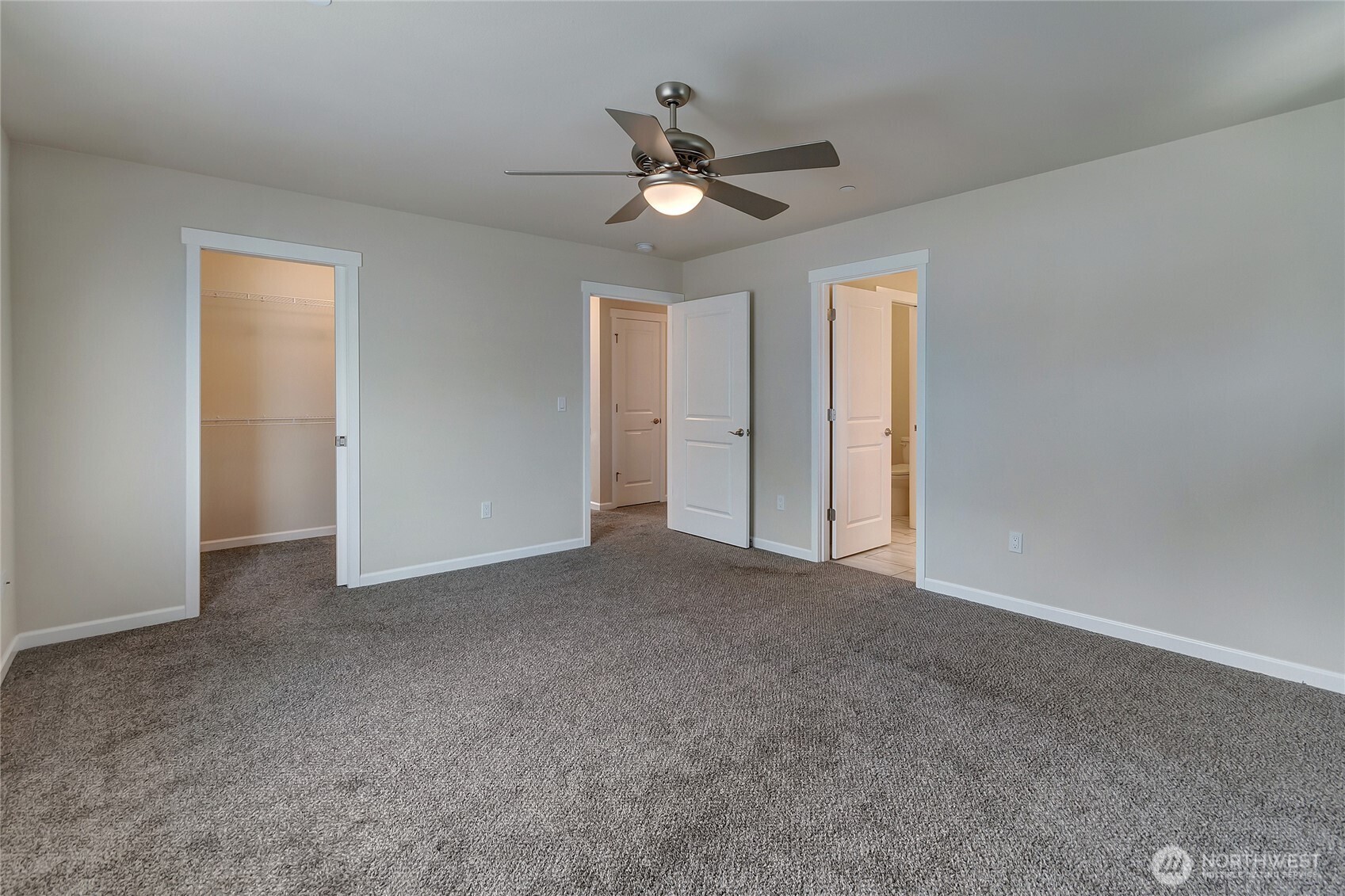 2213 Trail View Street Northeast Olympia, WA 98506 - Photo 29 of 40 a view of a livingroom with a ceiling fan & windows