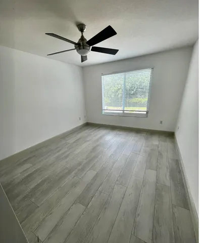 a view of a bathroom with a sink and a mirror