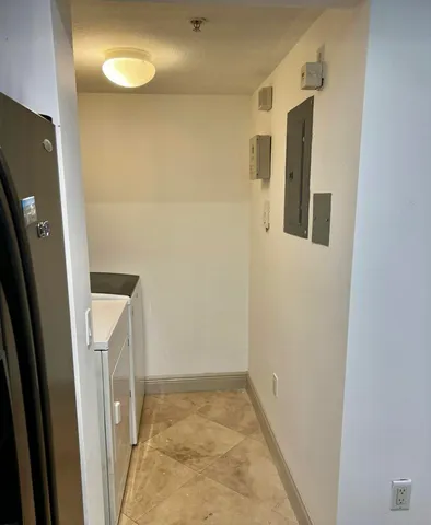 a bathroom with a toilet and bathtub