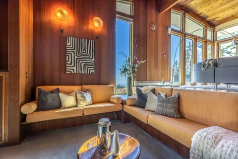 a living room with furniture gym equipment and a rug