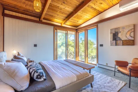 a bed room with a bed and a couch