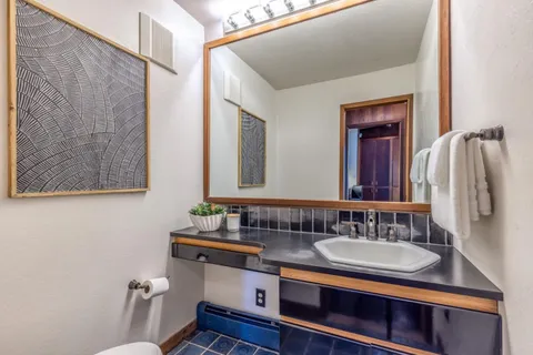 a view of a table and chairs in a patio