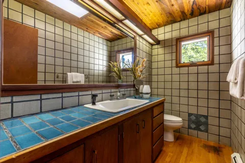 a view of a house with a yard and sitting area