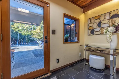 a room with sink and view of living room