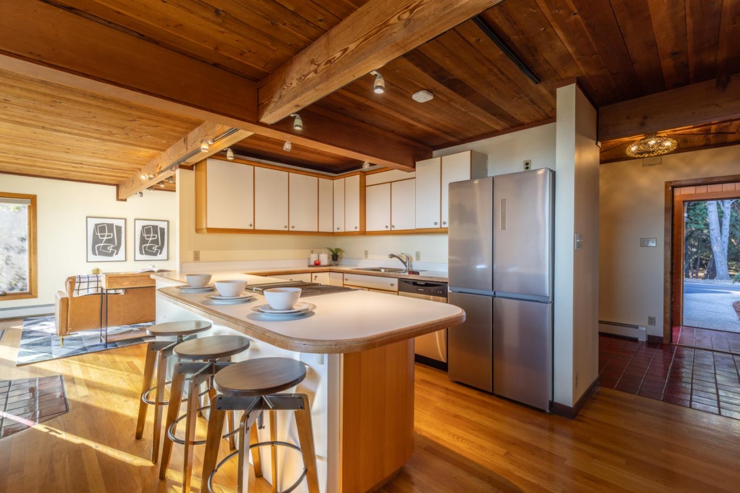 800 Rancho Prieta Road Los Gatos, CA 95033 - Photo 51 of 55 a kitchen with stainless steel appliances granite countertop a table chairs and wooden floor