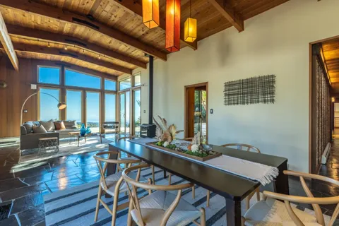 a outdoor living space with patio furniture and wooden floor