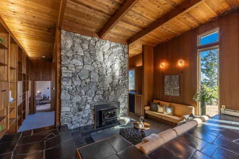 a bedroom with a bed and a fireplace