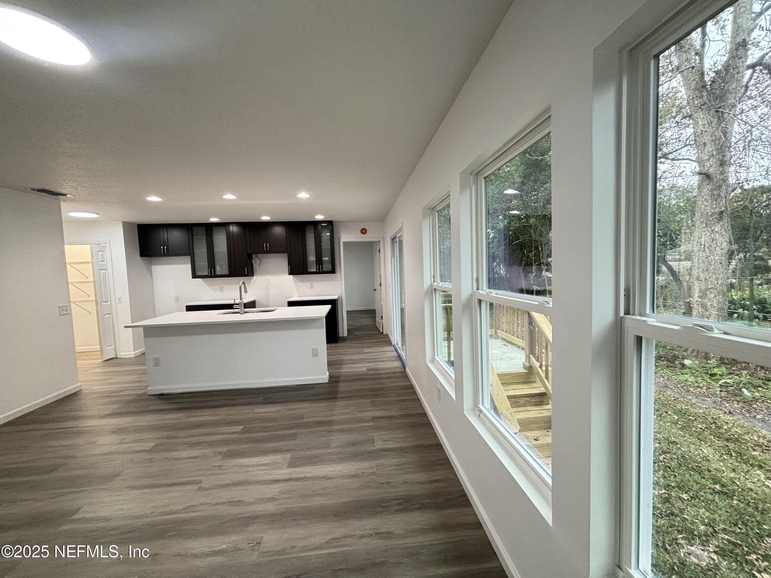 1992 West 20th Street Jacksonville, FL 32209 - Photo 11 of 28 a view of kitchen with kitchen island sink and wooden floor