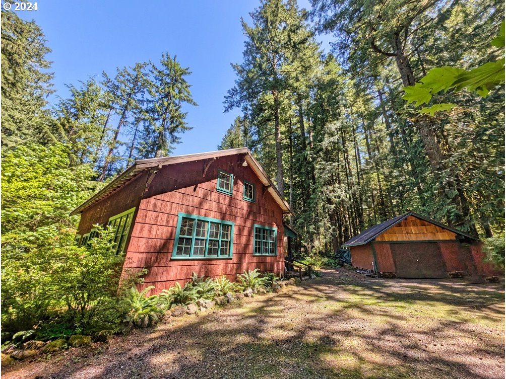 27602 Road 20 Rhododendron, OR 97049 - Photo 3 of 46 a view of a house with backyard and trees