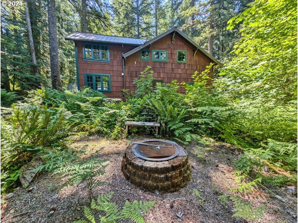 27602 Road 20 Rhododendron, OR 97049 - Photo 8 of 46 a front view of a house with a yard