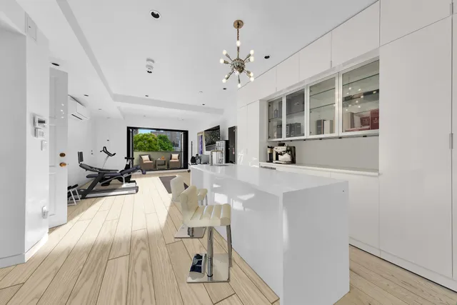 a bathroom with a sink and a chandelier