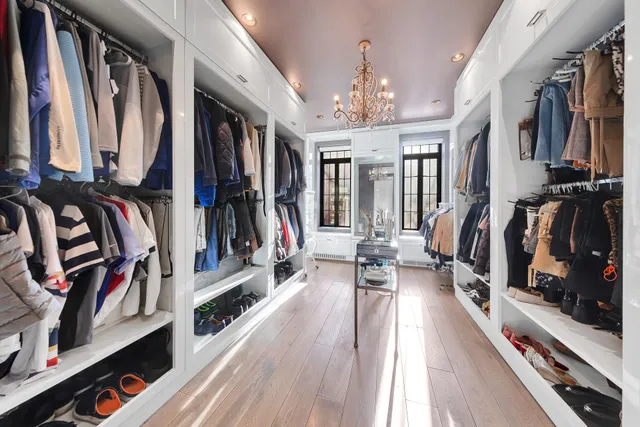 a bedroom with a bed and a desk