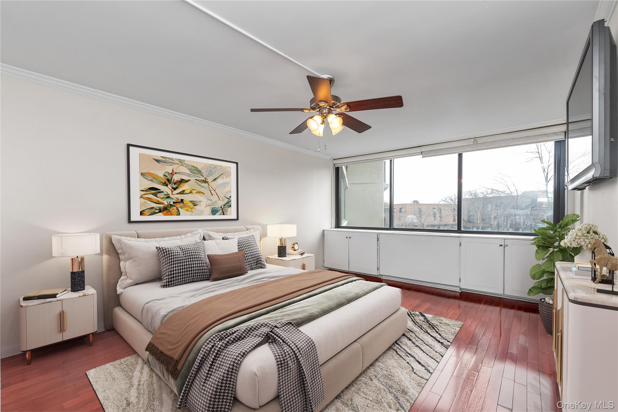 1 Bay Club Drive, Unit 4R Queens, NY 11360 - Photo 11 of 24 a bedroom with a large bed and a chandelier