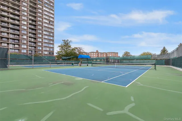 a view of a swimming pool with a yard