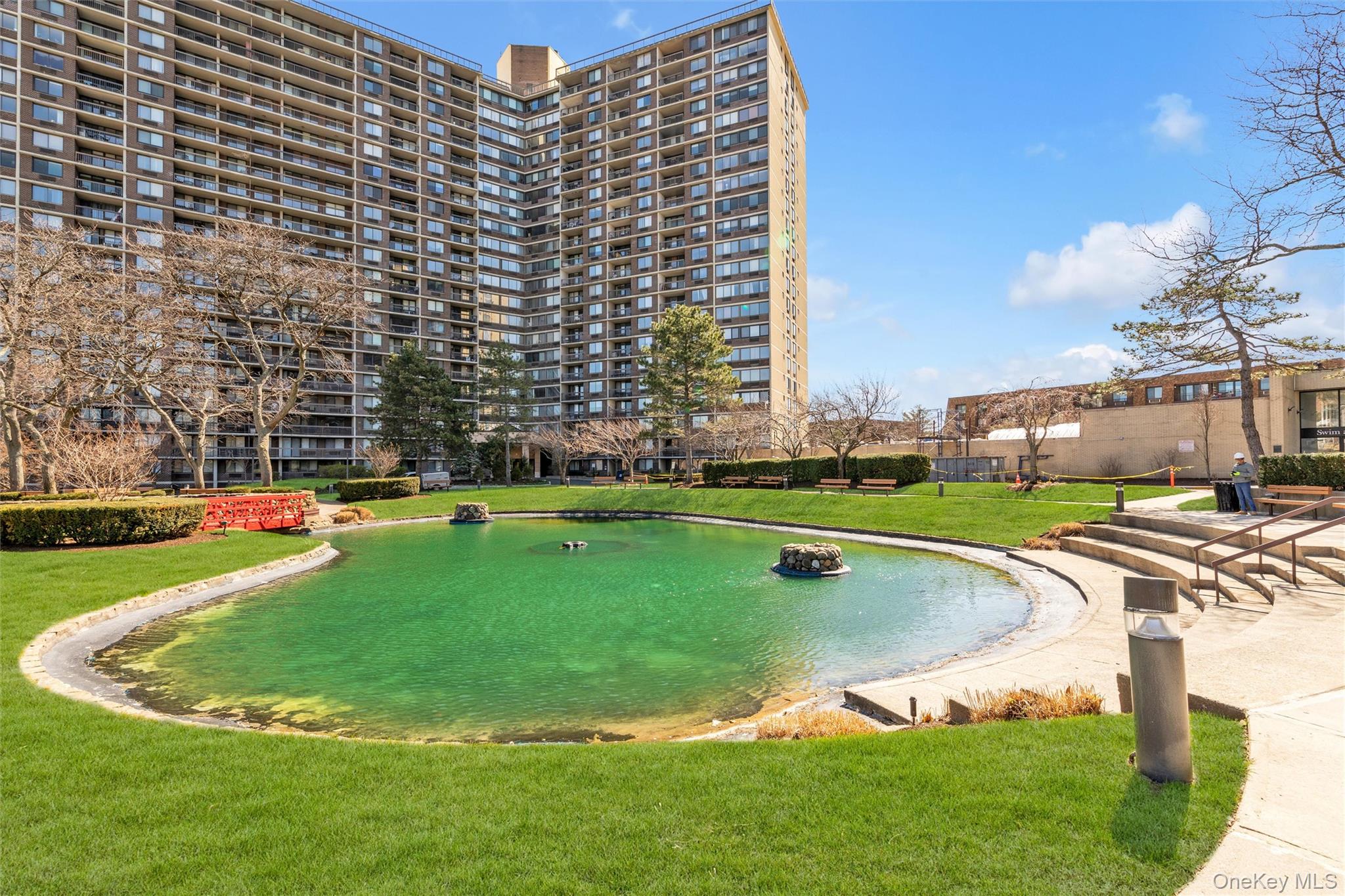 1 Bay Club Drive, Unit 4R Queens, NY 11360 - Photo 23 of 24 a view of a swimming pool with a yard