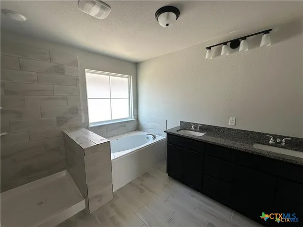a view of a bathroom with a bathtub