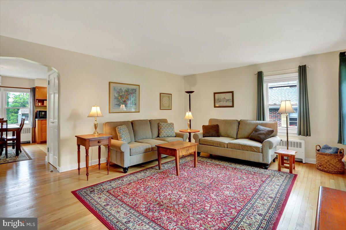 202 Old Fritztown Road Reading, PA 19607 - Photo 6 of 30 a living room with furniture a rug a lamp and wooden floor