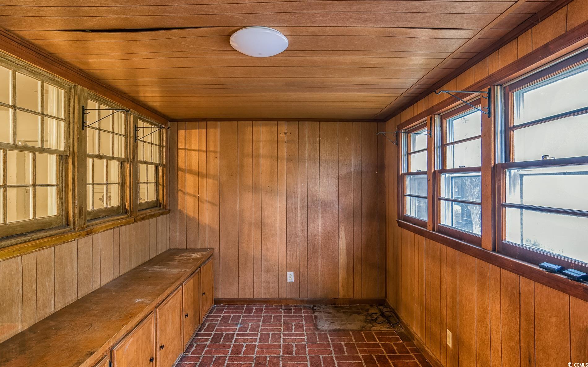 1010 Highmarket Street Georgetown, SC 29440 - Photo 17 of 32 Interior space featuring brick patterned floors, wood walls, wood ceiling, and a sauna