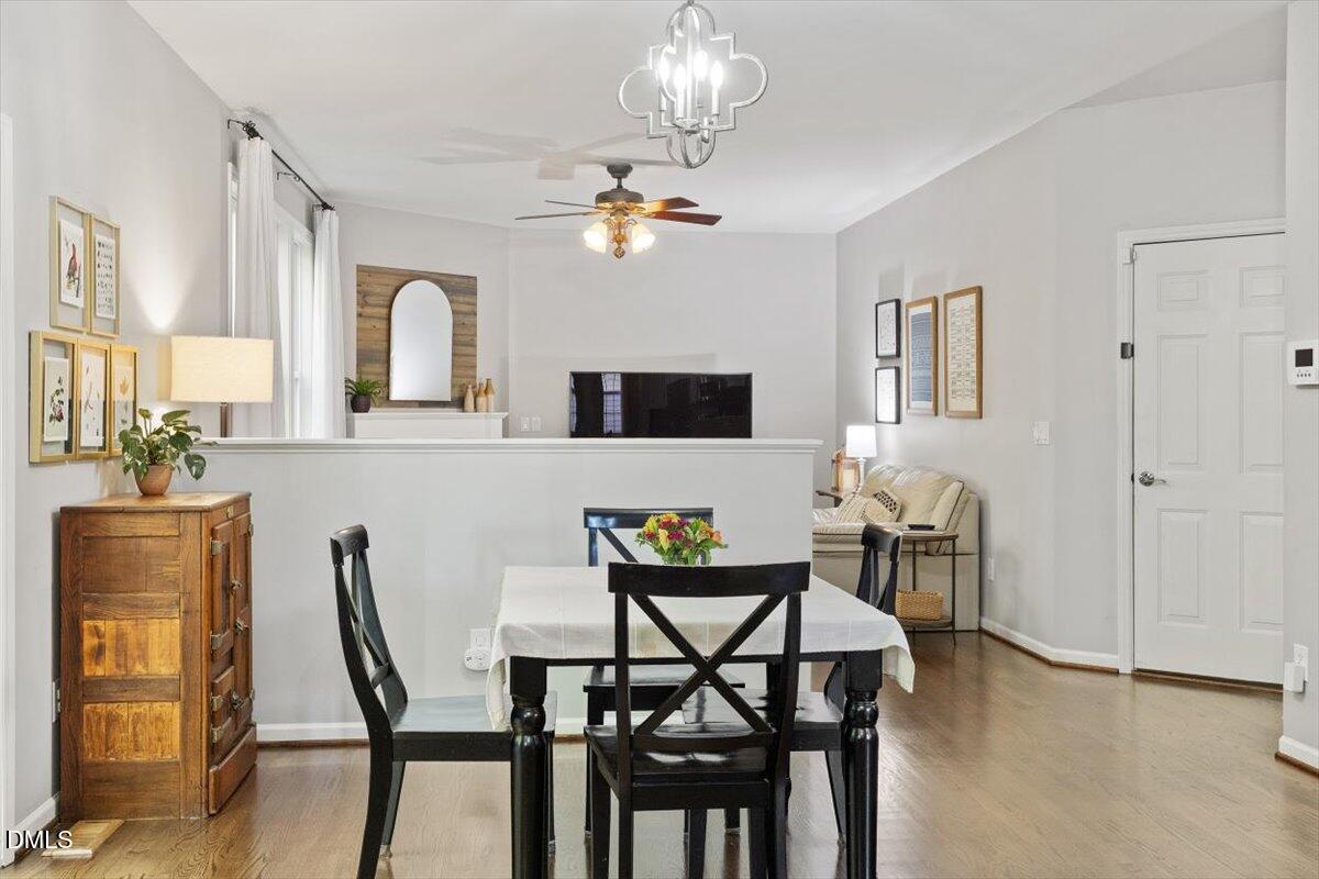 2220 Spruce Shadows Lane Raleigh, NC 27614 - Photo 11 of 29 a view of a dining room with furniture and chandelier