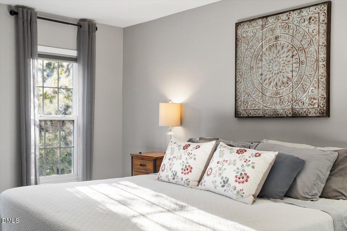 2220 Spruce Shadows Lane Raleigh, NC 27614 - Photo 18 of 29 a bedroom with a large bed and a window