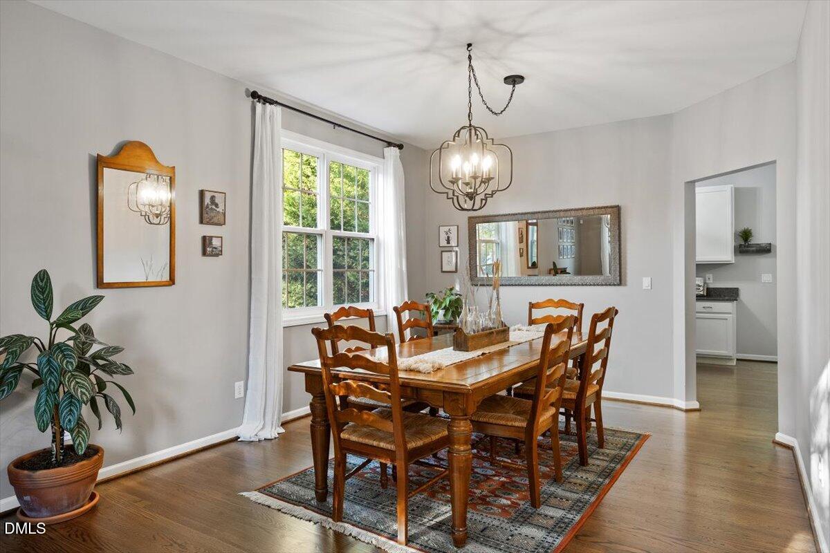 2220 Spruce Shadows Lane Raleigh, NC 27614 - Photo 5 of 29 a view of a dining room with furniture window and wooden floor