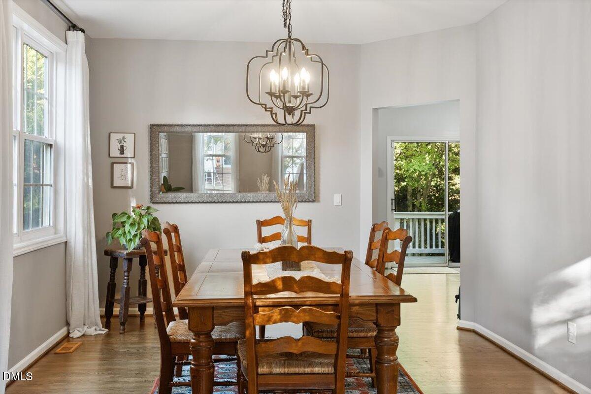2220 Spruce Shadows Lane Raleigh, NC 27614 - Photo 7 of 29 a dining room with furniture and wooden floor