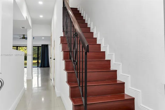 a kitchen with stainless steel appliances a refrigerator sink and microwave