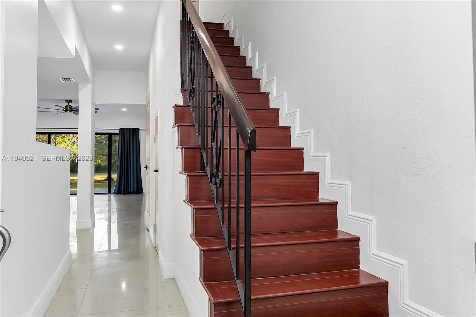 8898 Southwest 62nd Terrace, Unit 7F Miami, FL 33173 - Photo 11 of 66 a view of entryway and hall with wooden floor