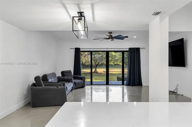 a view of swimming pool with an outdoor space and seating area