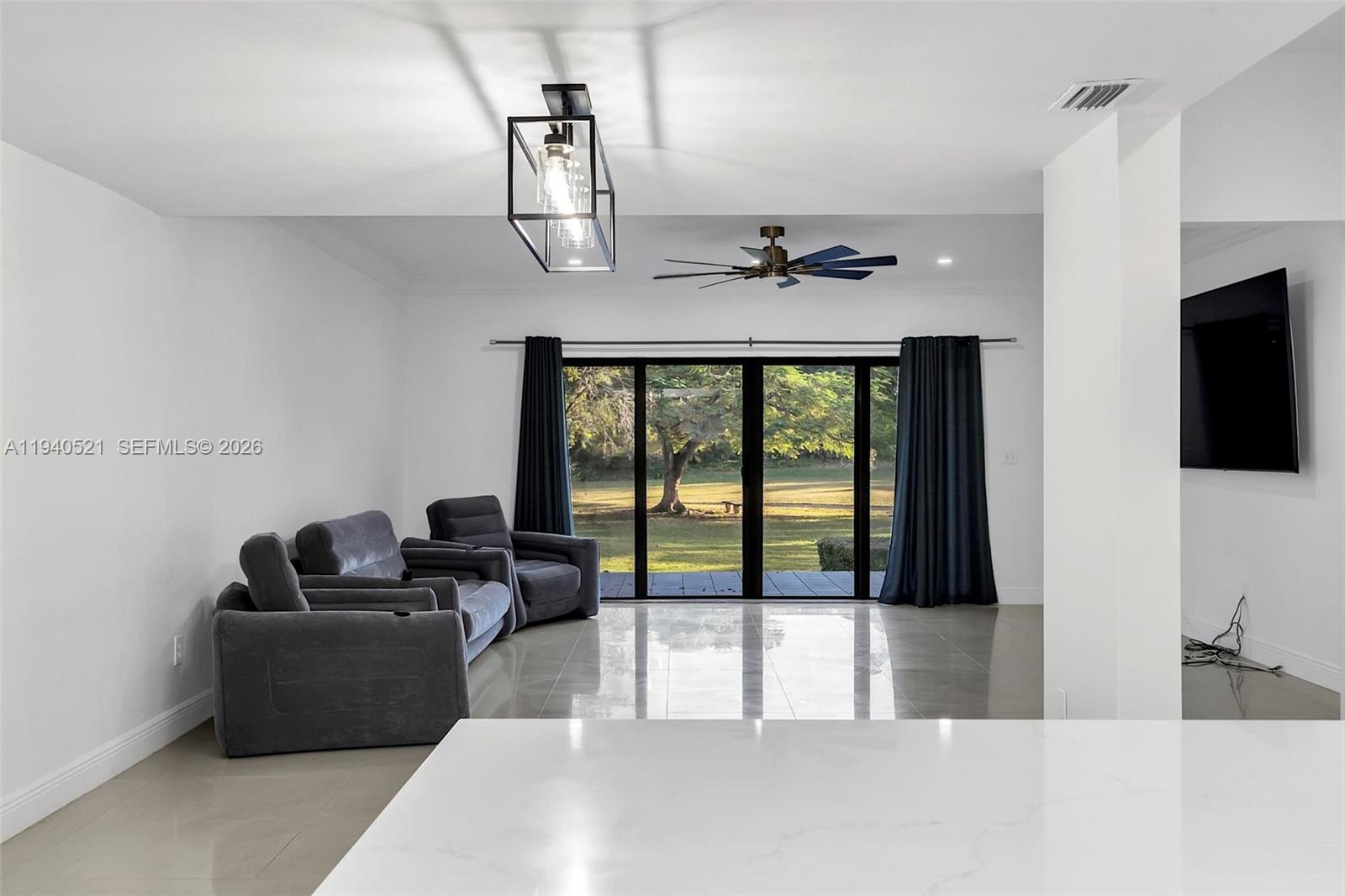 8898 Southwest 62nd Terrace, Unit 7F Miami, FL 33173 - Photo 20 of 66 a living room with furniture