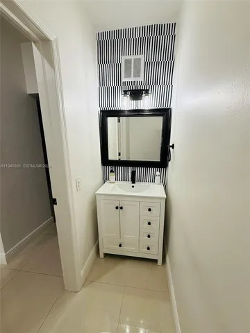 a living room with furniture and a ceiling fan