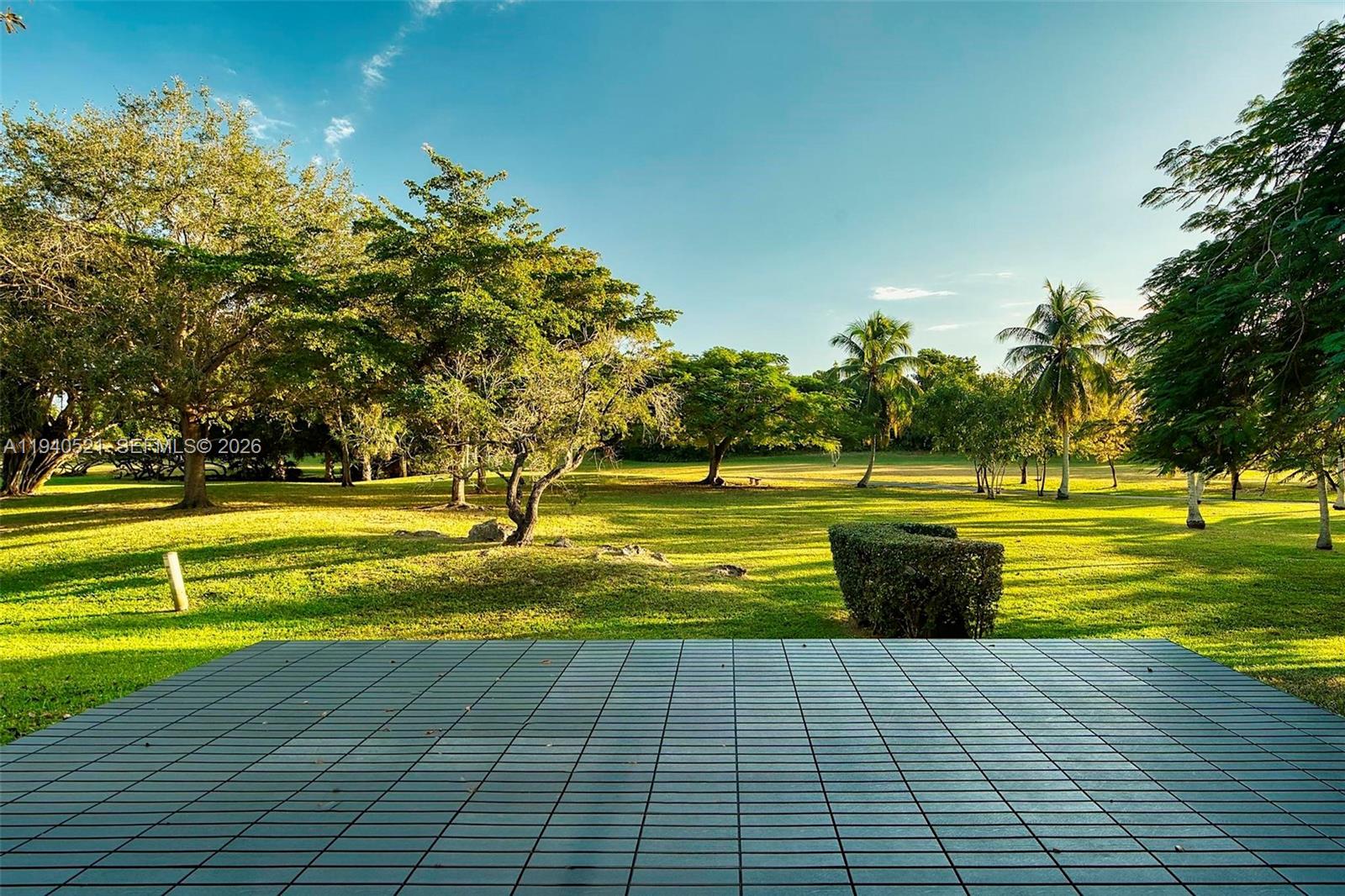 8898 Southwest 62nd Terrace, Unit 7F Miami, FL 33173 - Photo 29 of 66 a view of swimming pool with an outdoor space and seating area
