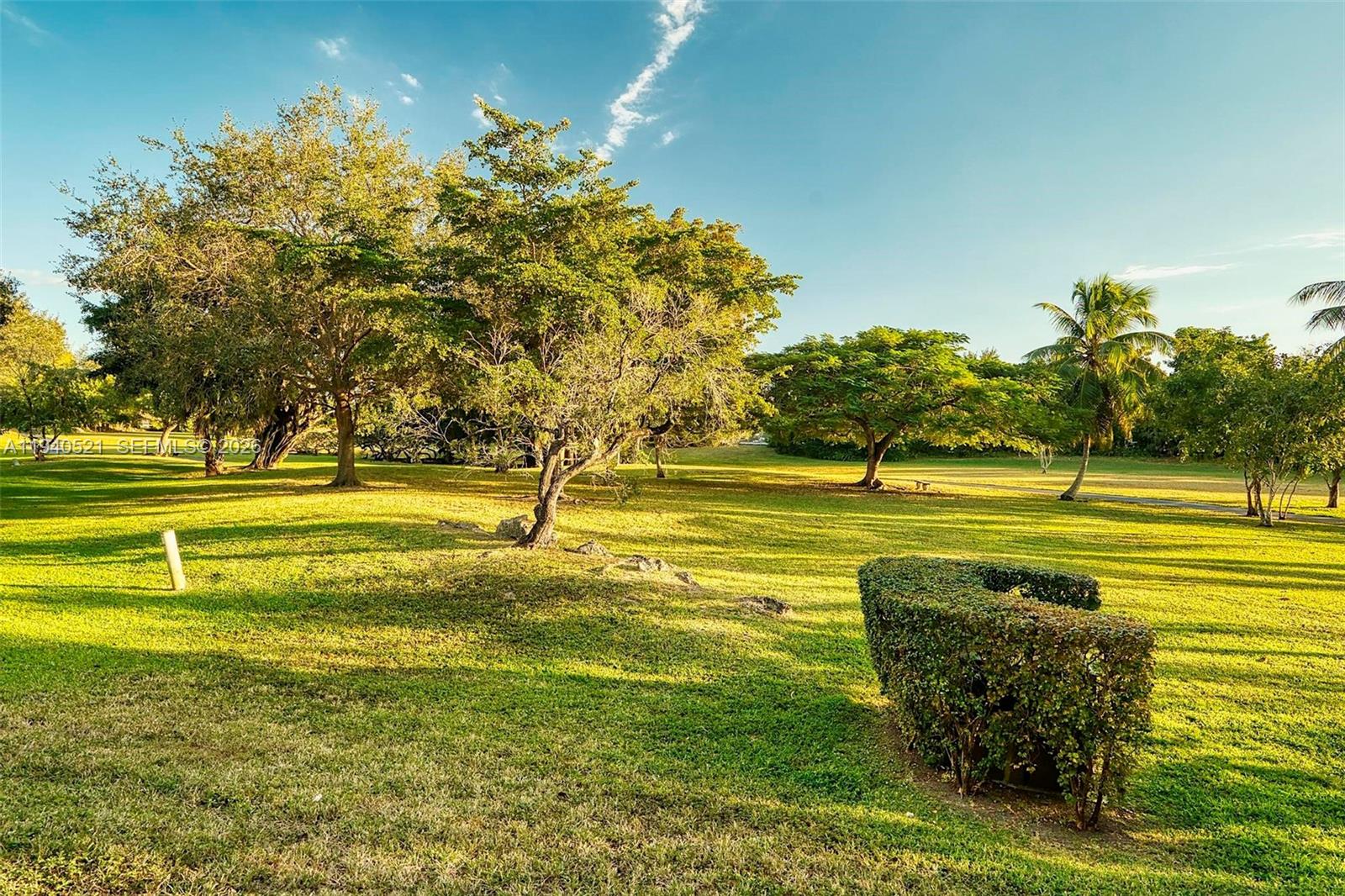 8898 Southwest 62nd Terrace, Unit 7F Miami, FL 33173 - Photo 31 of 66 a view of a swimming pool with an outdoor space