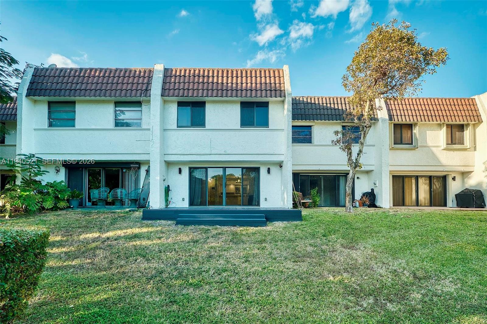 8898 Southwest 62nd Terrace, Unit 7F Miami, FL 33173 - Photo 33 of 66 a front view of a house with a garden