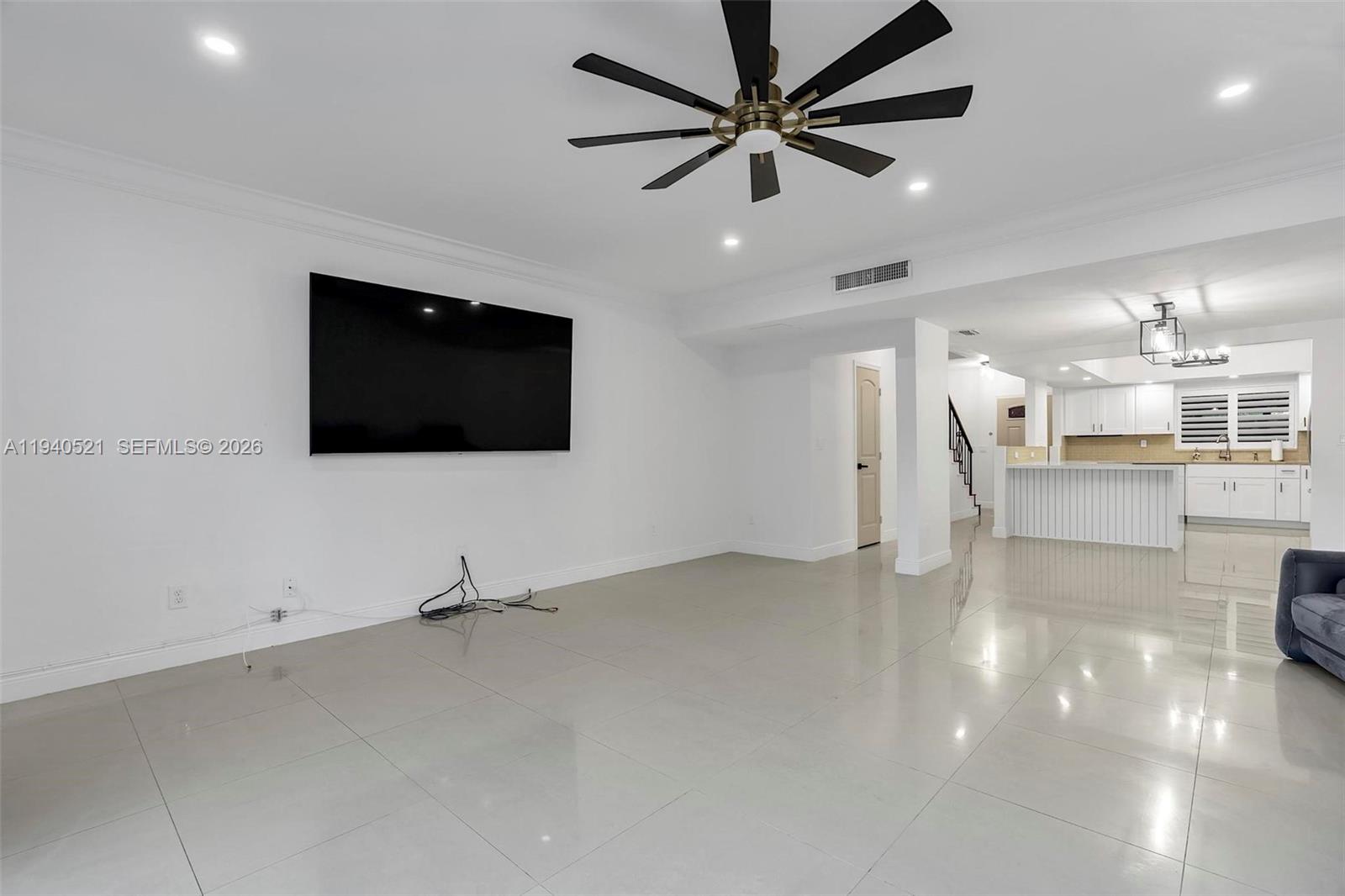 8898 Southwest 62nd Terrace, Unit 7F Miami, FL 33173 - Photo 36 of 66 a view of a livingroom with a flat screen tv